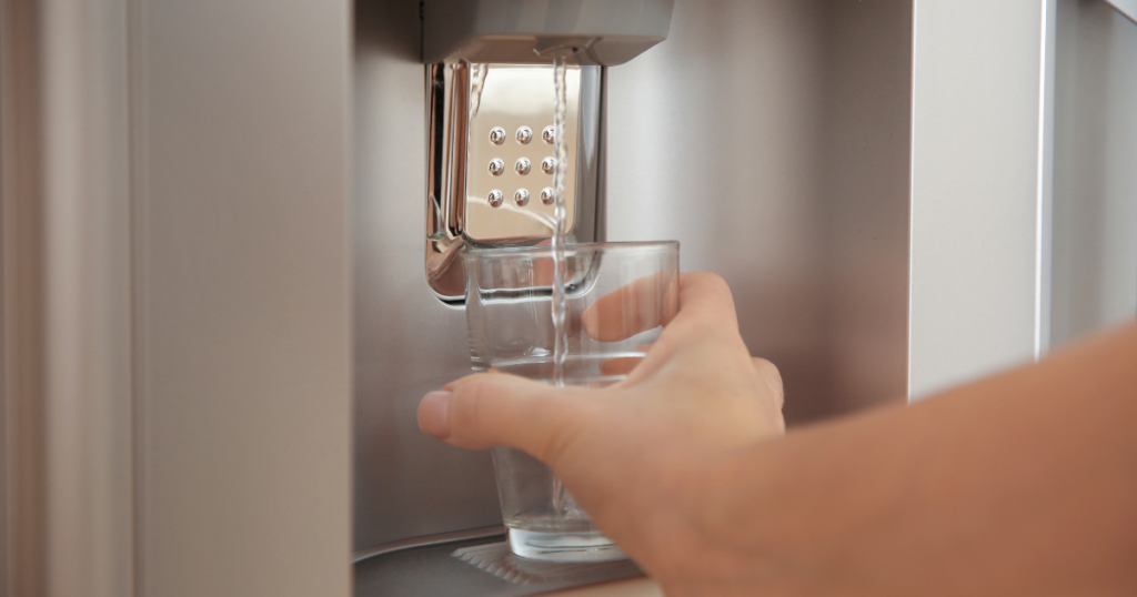 getting a glass of water from fridge